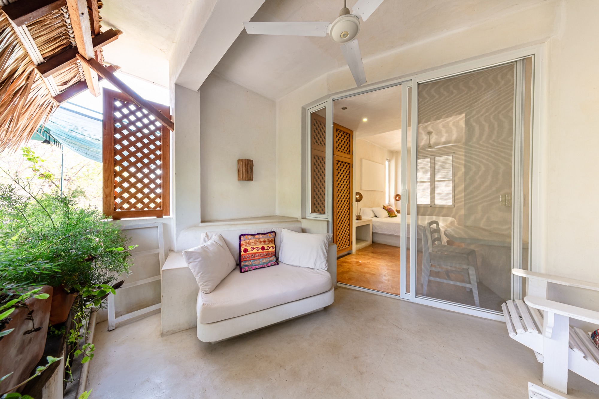 A bright Villa María guest room with garden views